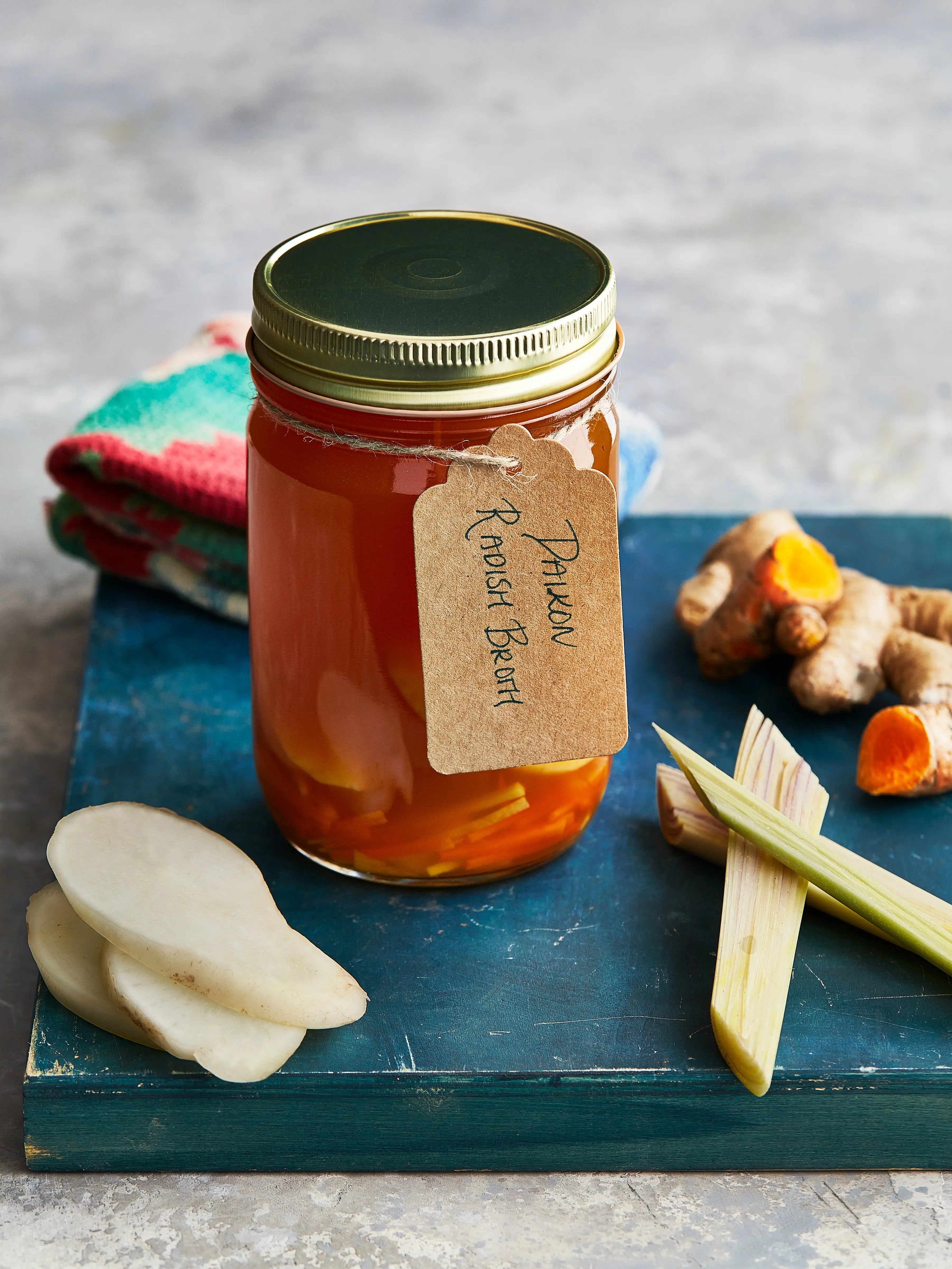 Daikon radish broth displayed with some ginger for upcoming menu provided by Laroot World, an organic, local, gluten free New York City flexitarian, pescatarian, carnitarian, vegan, and vegetarian meal delivery service