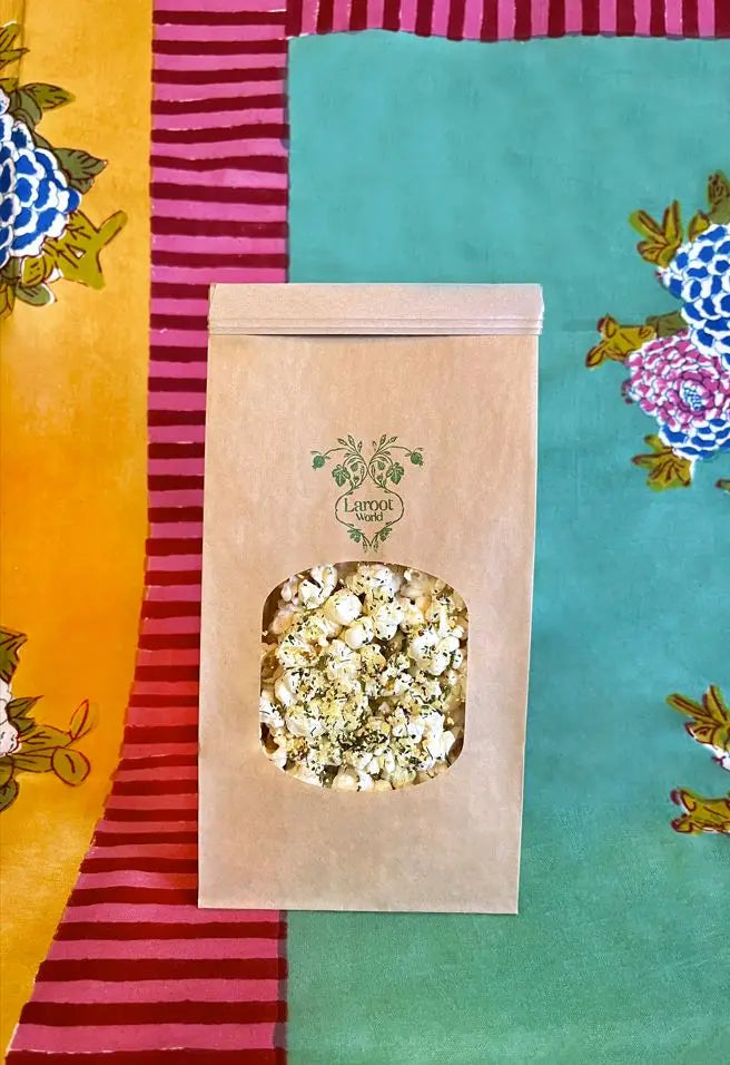 Laroot Heirloom Popcorn on a blue, pink and yellow tablecloth for upcoming menu provided by Laroot World, an organic, local, gluten free New York City flexitarian, pescatarian, carnitarian, vegan, and vegetarian meal delivery service 