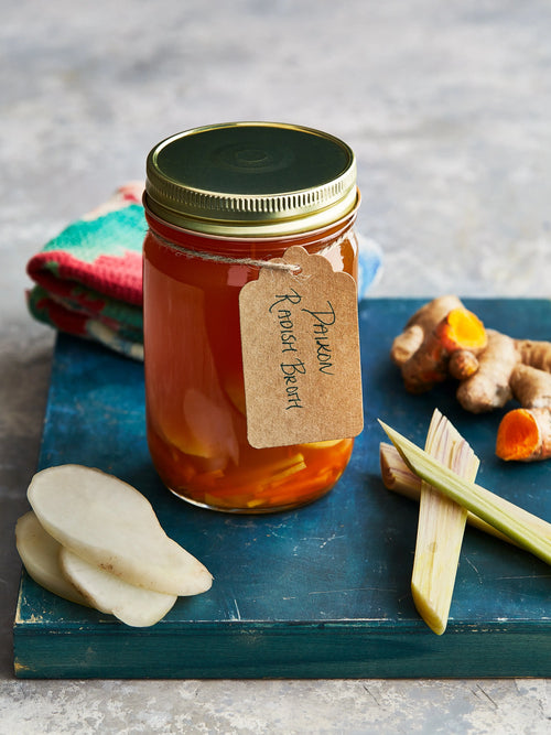 Daikon radish broth displayed with some ginger for upcoming menu provided by Laroot World, an organic, local, gluten free New York City flexitarian, pescatarian, carnitarian, vegan, and vegetarian meal delivery service 