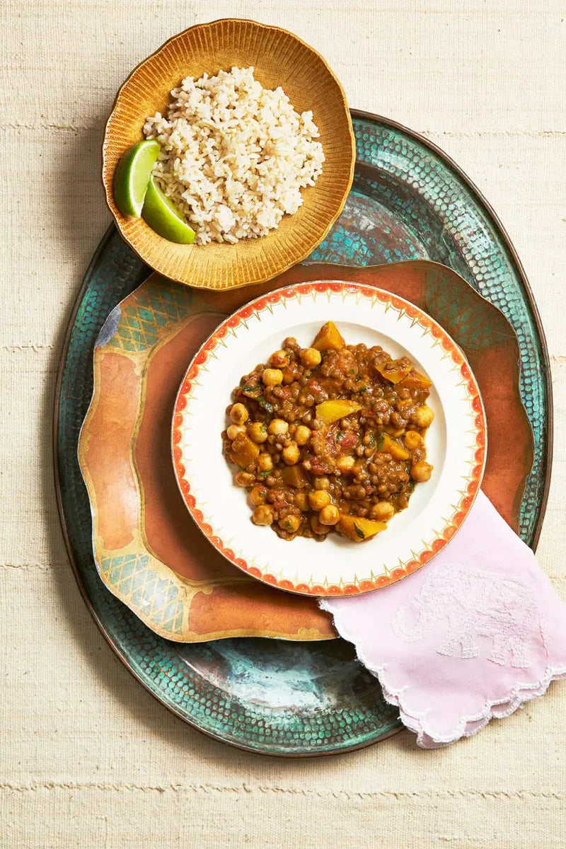 A plate of Kala Chana Masala on a tray for upcoming menu provided by Laroot World, an organic, local, gluten free New York City flexitarian, pescatarian, carnitarian, vegan, and vegetarian meal delivery service 